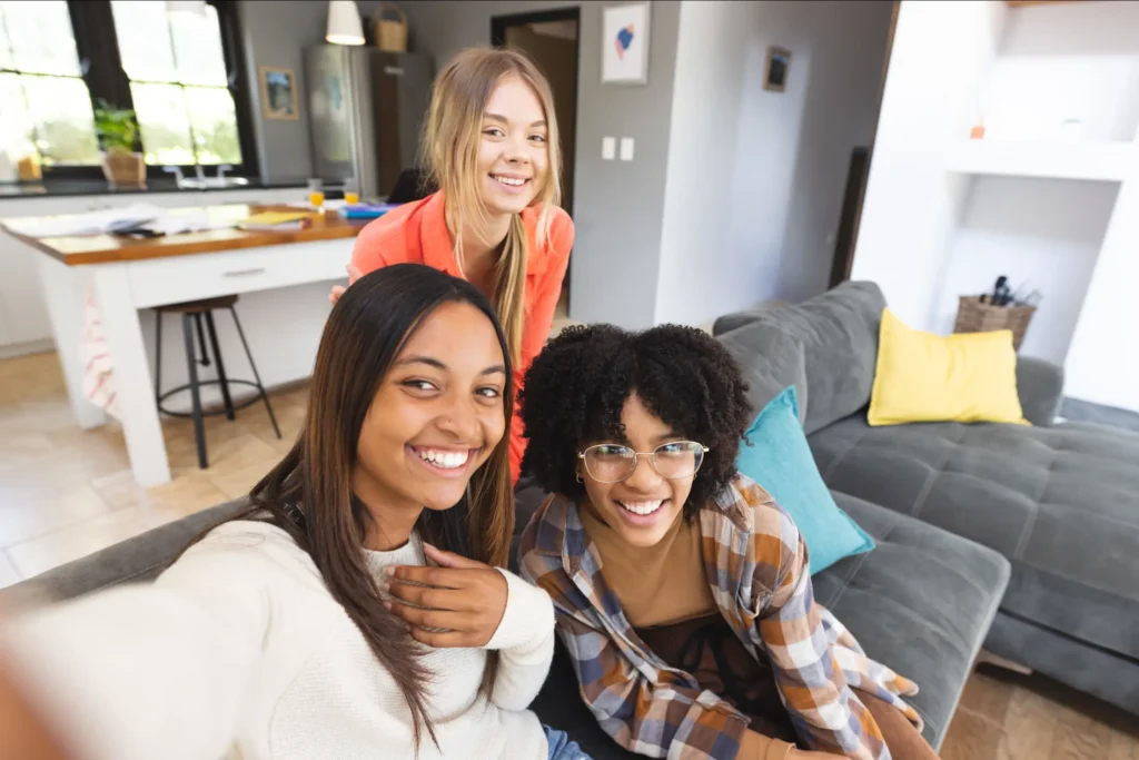 Diverse group of happy teenage friends receiving compassionate care in Truro and Swindon