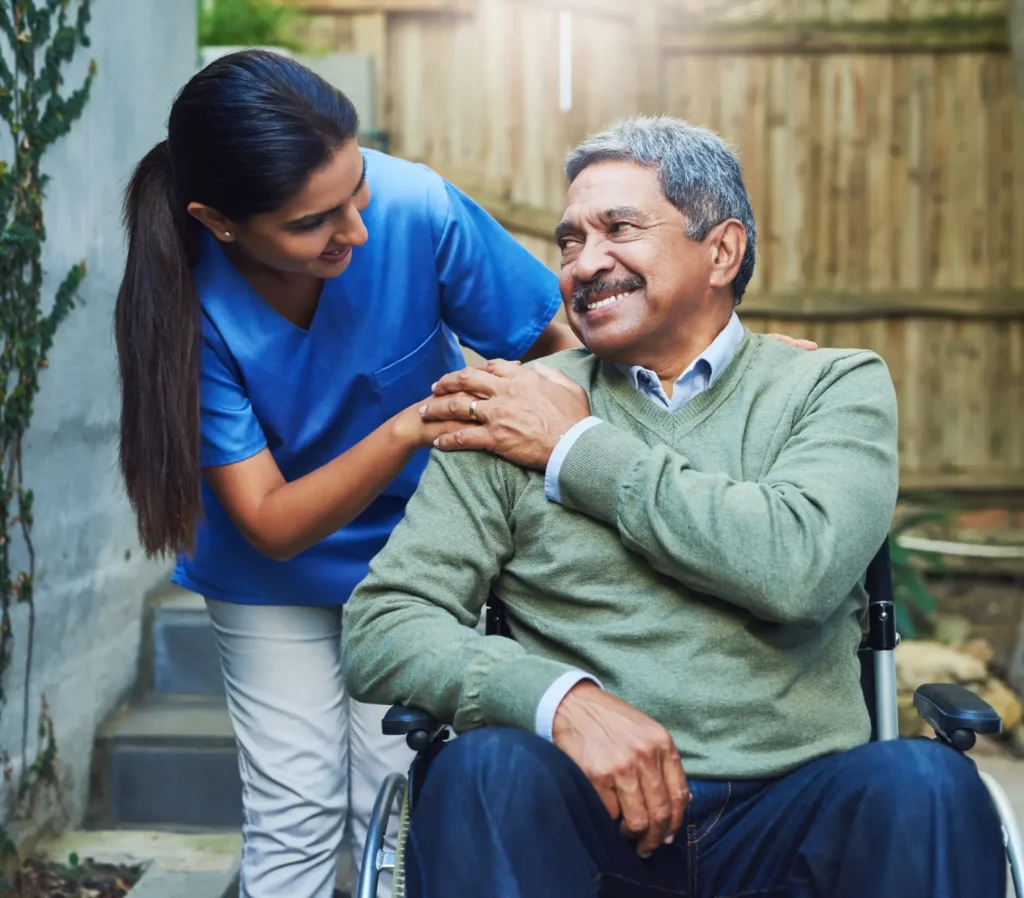 Smiling elderly woman thanking her compassionate caregiver during home visit in Truro