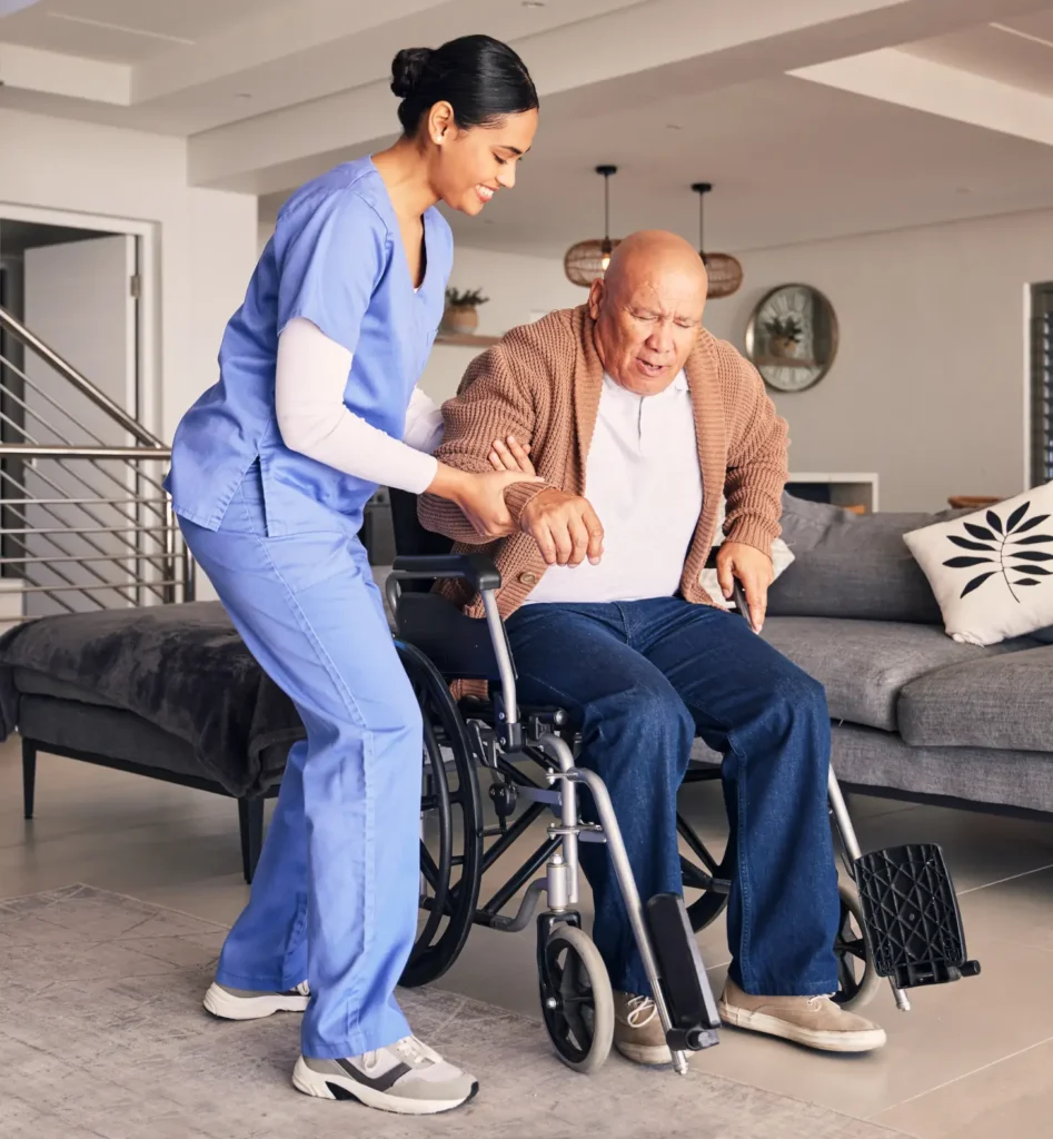 Compassionate nurse providing domiciliary care for a man in a wheelchair in Truro and Swindon