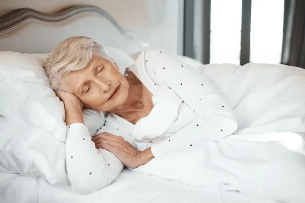 Elderly woman resting peacefully at home with support from Truro & Swindon care team