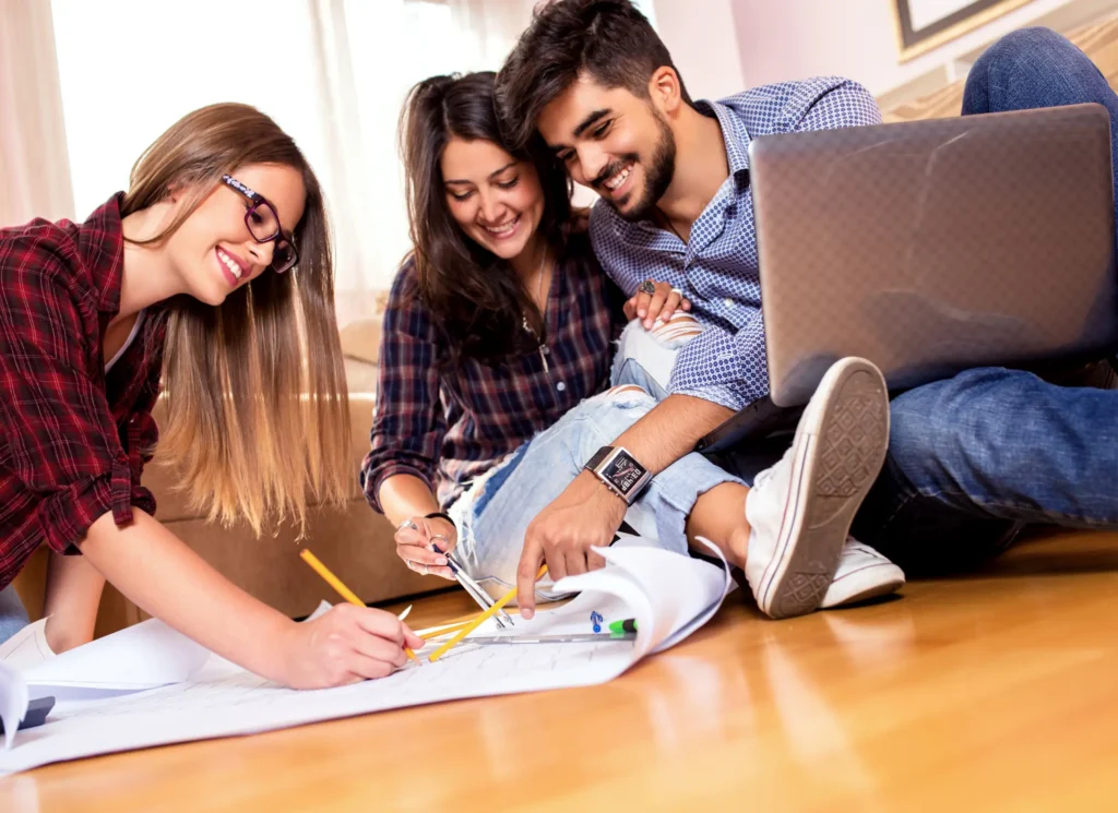 Three young adults with learning disabilities developing life skills together in supported living home, Truro and Swindon