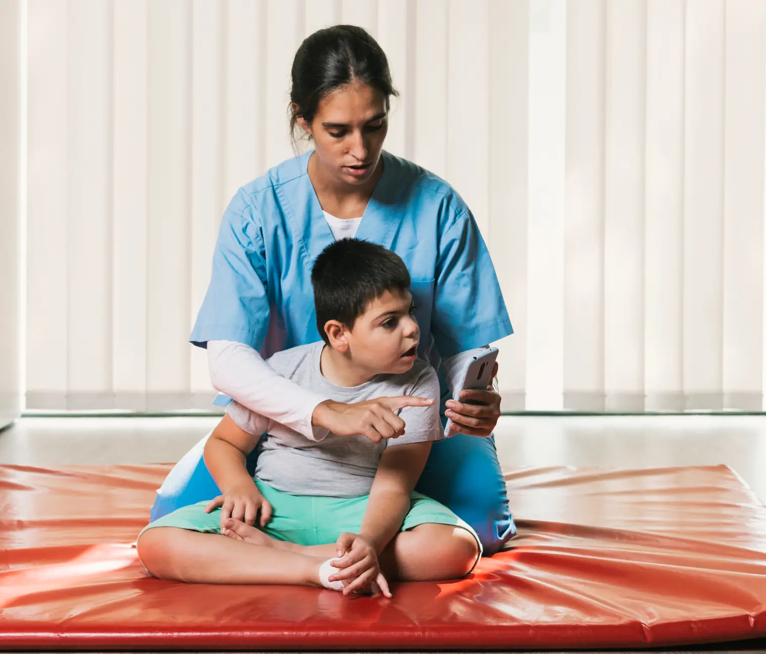  Kind physiotherapist assisting a child with cerebral palsy during therapy in Swindon